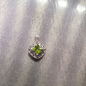 Dainty sterling silver charm with green stone
